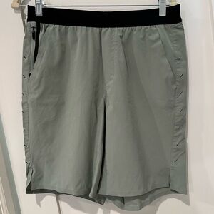 Ten Thousand interval shorts. Unlined, 9" inseam, medium. Light green.
